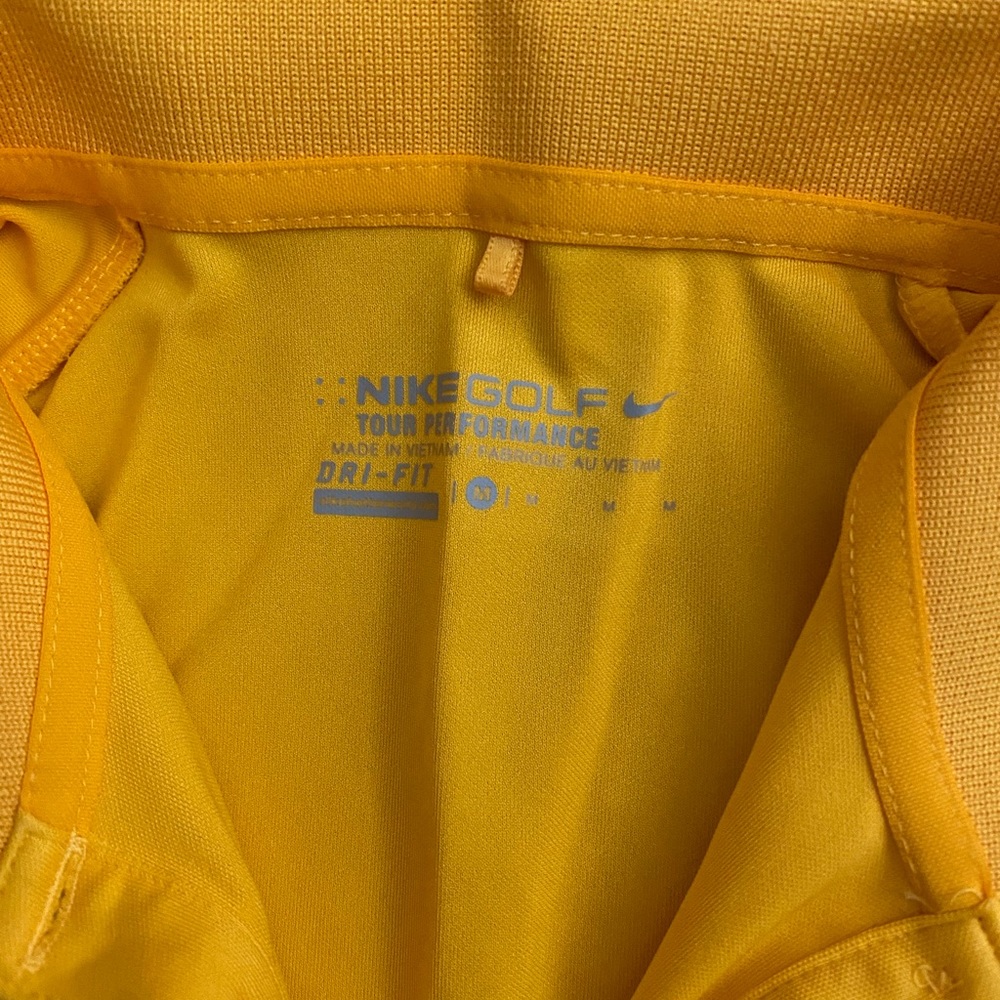 Nike M colored golf shirt. Yellow one only.